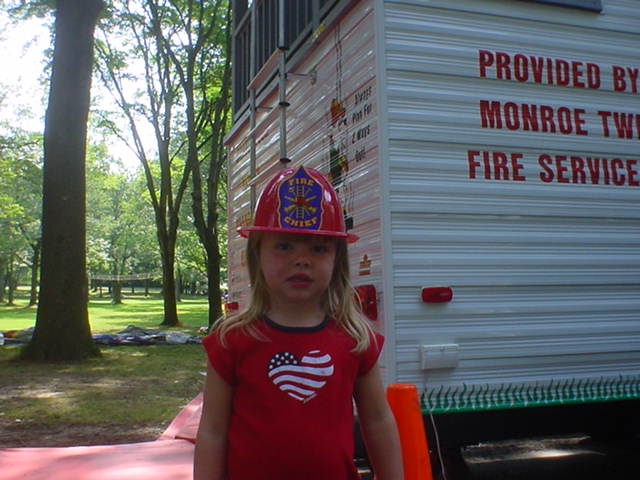 A Young Girl in a Fire Hat