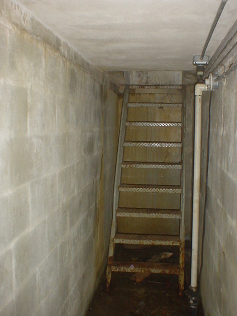 The tunnel leading to the vacant teller window.
