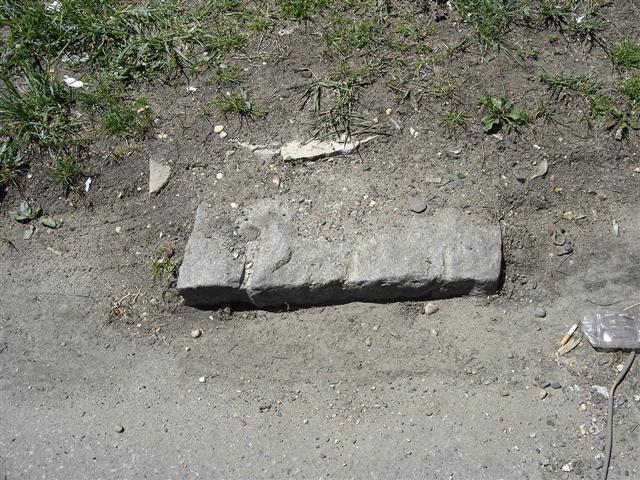 The stone sticking out on Bucklew Avenue in April 2005.
